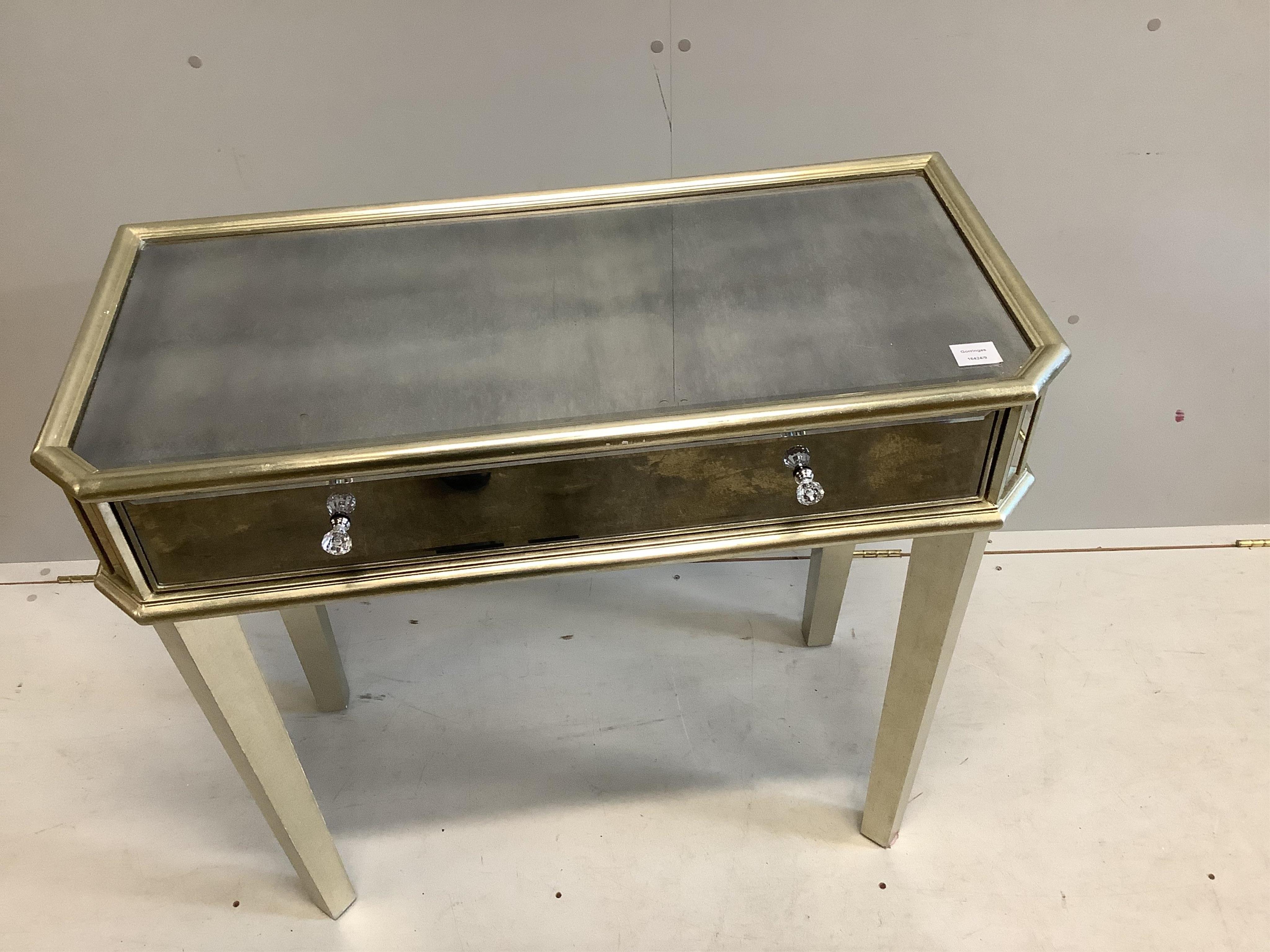 A Contemporary mirrored side table, width 92cm, depth 43cm, height 83cm. Condition - fair